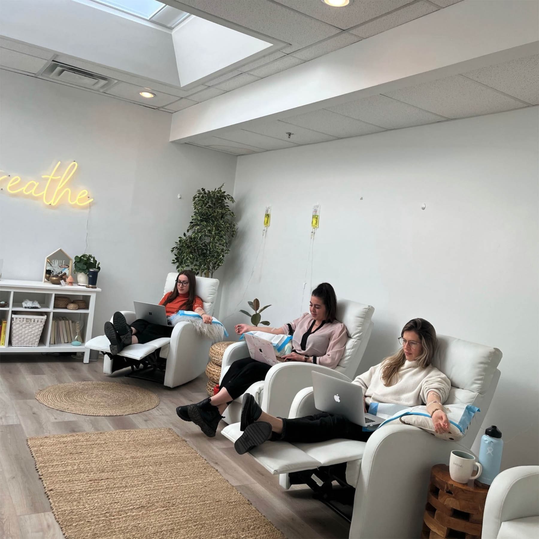 Client receiving IV vitamin therapy for clear, healthy skin at Higher Health