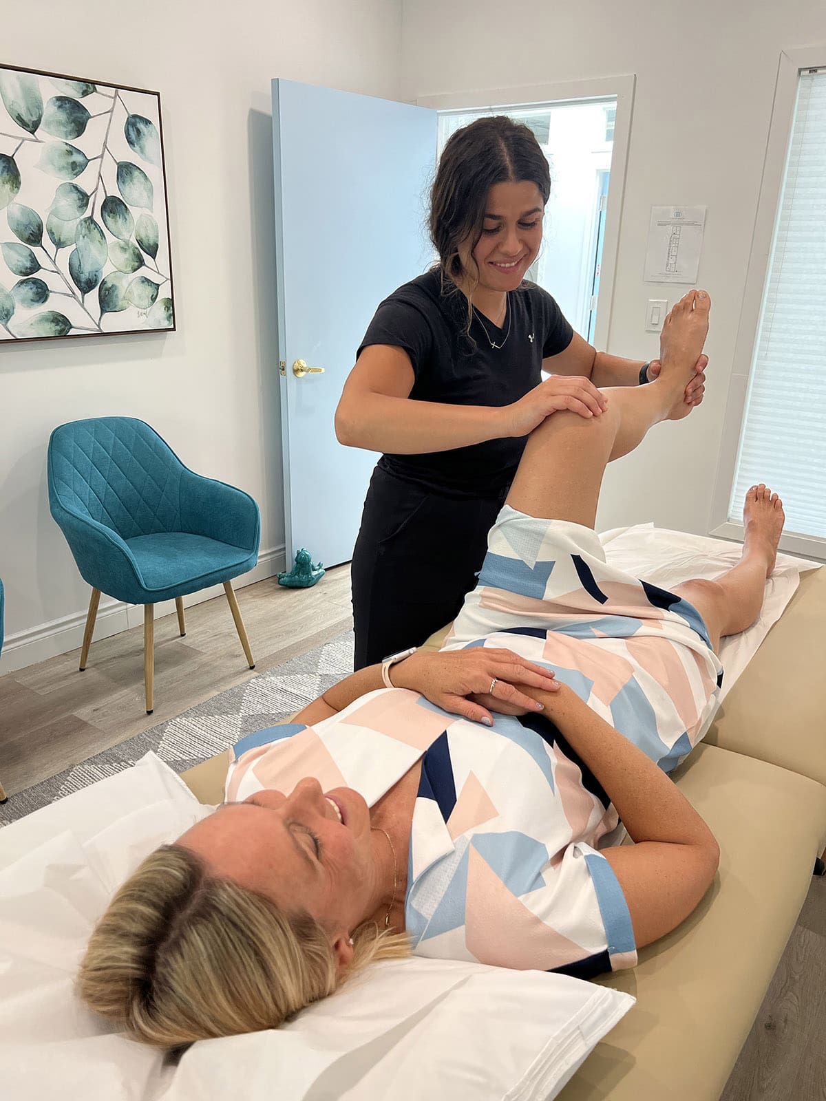 Chiropractor gently adjusting a patient’s spine at Higher Health Clinic in Toronto